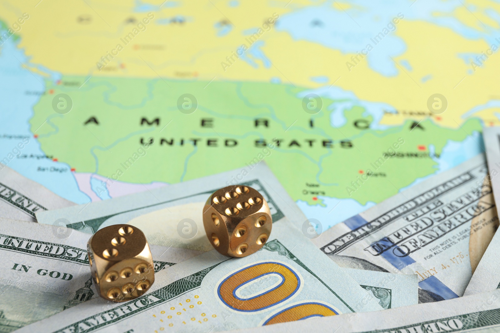 Photo of Gold dices and money near USA on world map