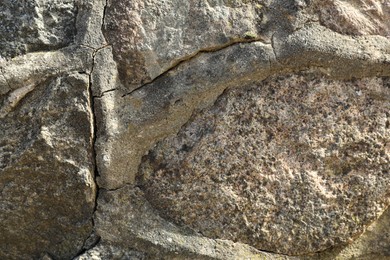 Photo of Texture of grey stone surface as background