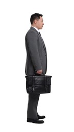 Businessman with briefcase posing on white background