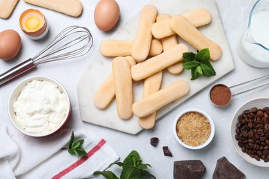 Flat lay composition with ingredients for tiramisu on light grey table