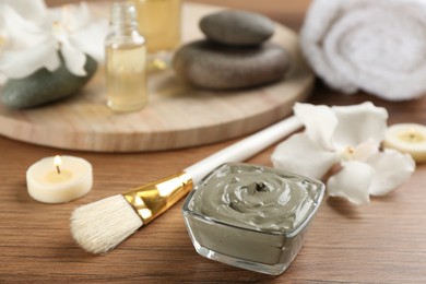 Photo of Composition with cosmetic product for spa body wraps on wooden background