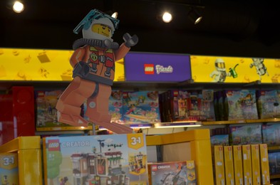 Photo of AMSTERDAM, NETHERLANDS - SEPTEMBER 10, 2022: Human figure made with colorful Lego constructor indoors