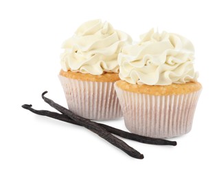 Tasty cupcakes with cream and vanilla pods isolated on white