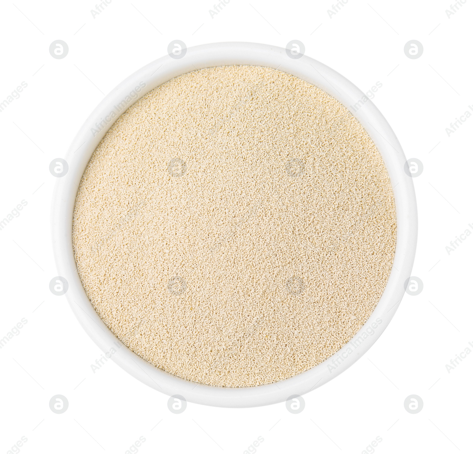 Photo of Granulated yeast in bowl on white background, top view