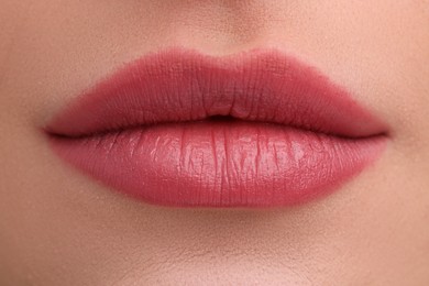 Photo of Young woman with beautiful full lips as background, closeup