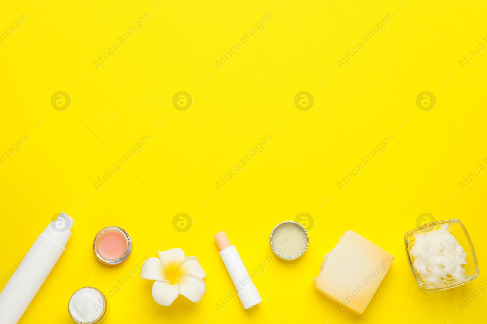 Photo of Flat lay composition with beeswax cosmetics on yellow background. Space for text