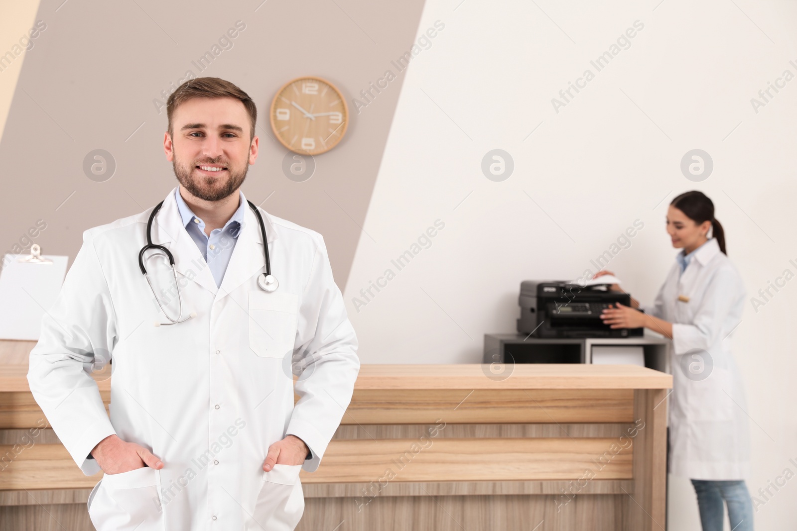 Photo of Professional staff working at reception in modern clinic
