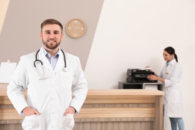 Photo of Professional staff working at reception in modern clinic