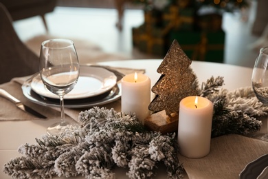 Elegant table setting with Christmas decor indoors