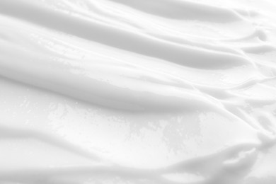 Photo of Texture of face cream as background, closeup view