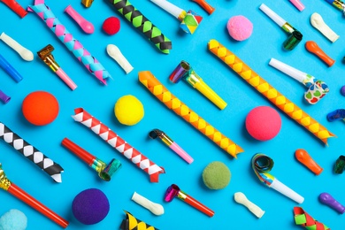 Photo of Different clown's accessories on light blue background, flat lay