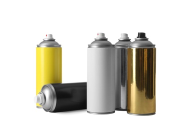 Photo of Cans of different spray paints on white background