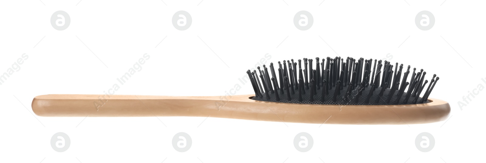 Photo of New wooden hair brush isolated on white