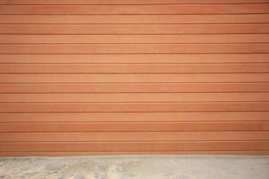 Photo of View on urban wooden wall and sand