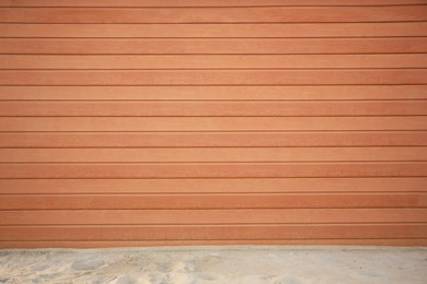 View on urban wooden wall and sand