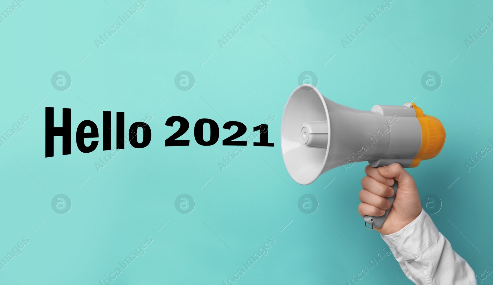 Image of Hello 2021. Man holding megaphone on turquoise background, closeup