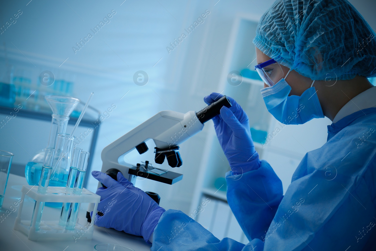 Photo of Scientist working with microscope in laboratory. Medical research