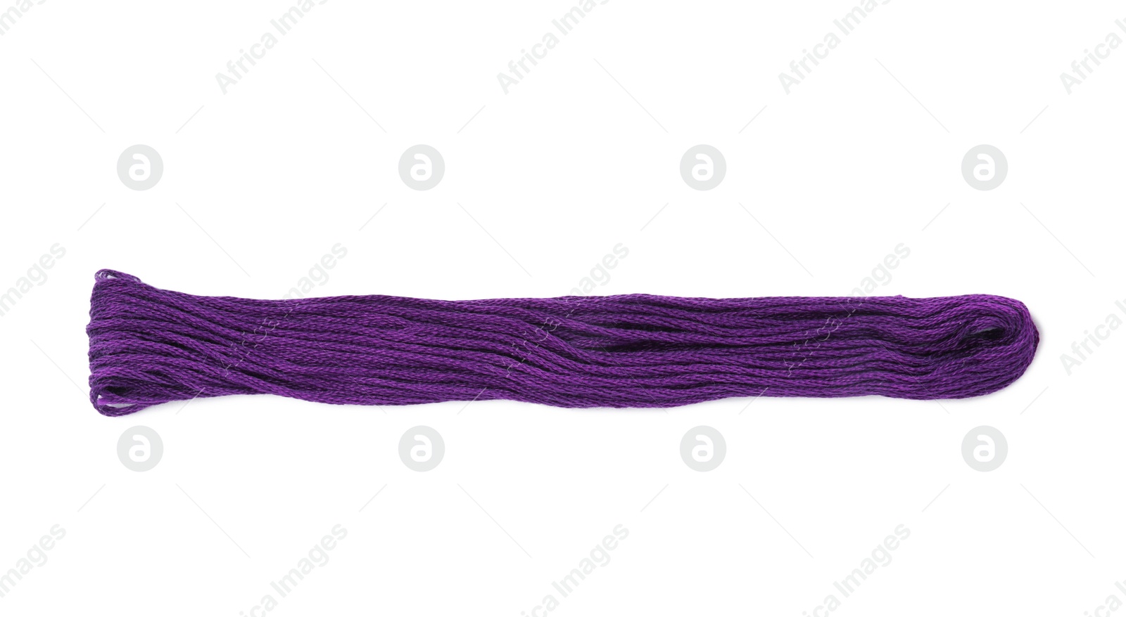Photo of Bright purple embroidery thread on white background