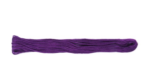 Bright purple embroidery thread on white background