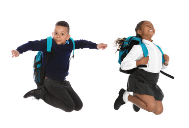 Image of African American children in school uniform jumping on white background
