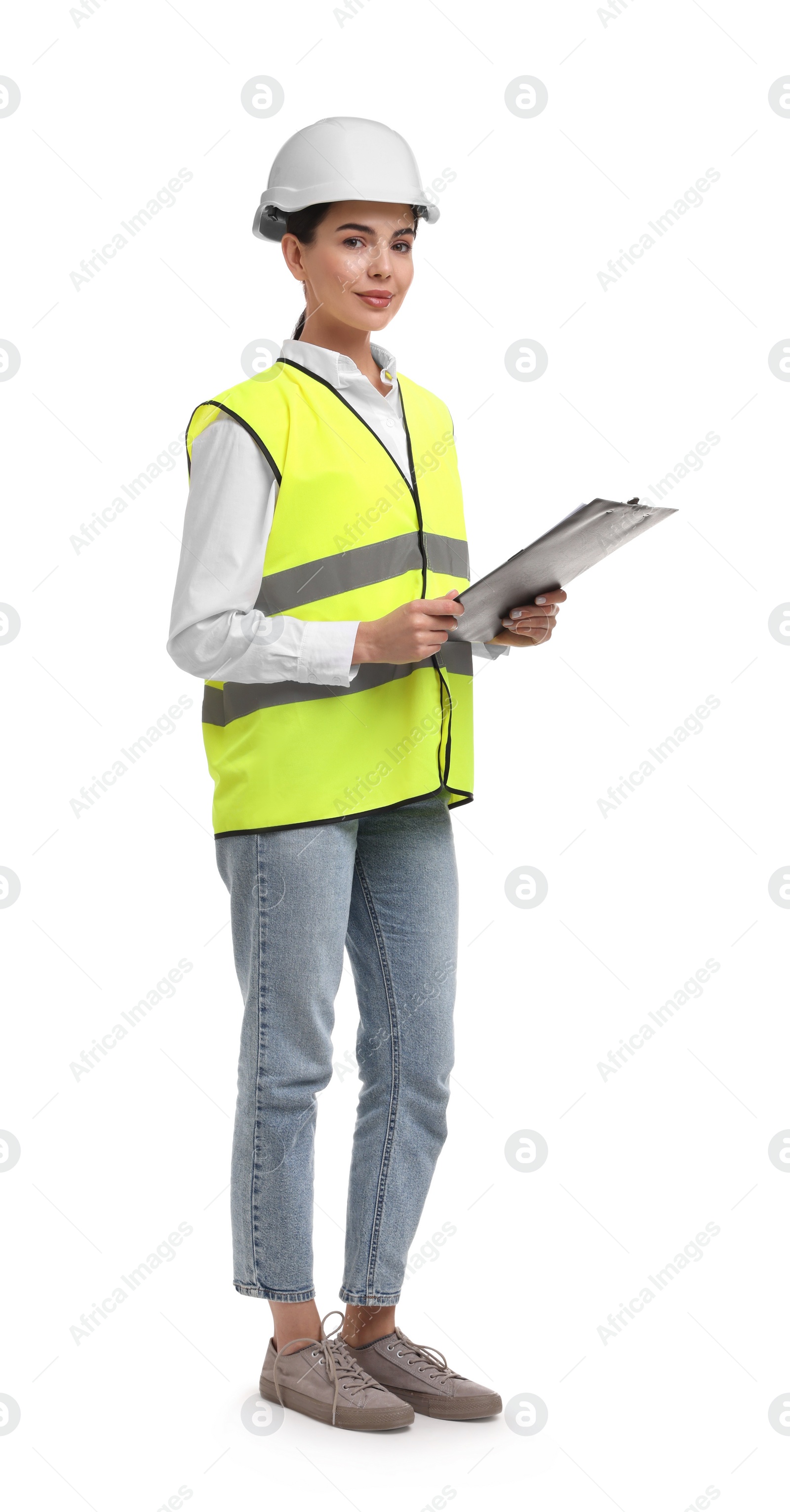 Photo of Engineer in hard hat holding clipboard on white background