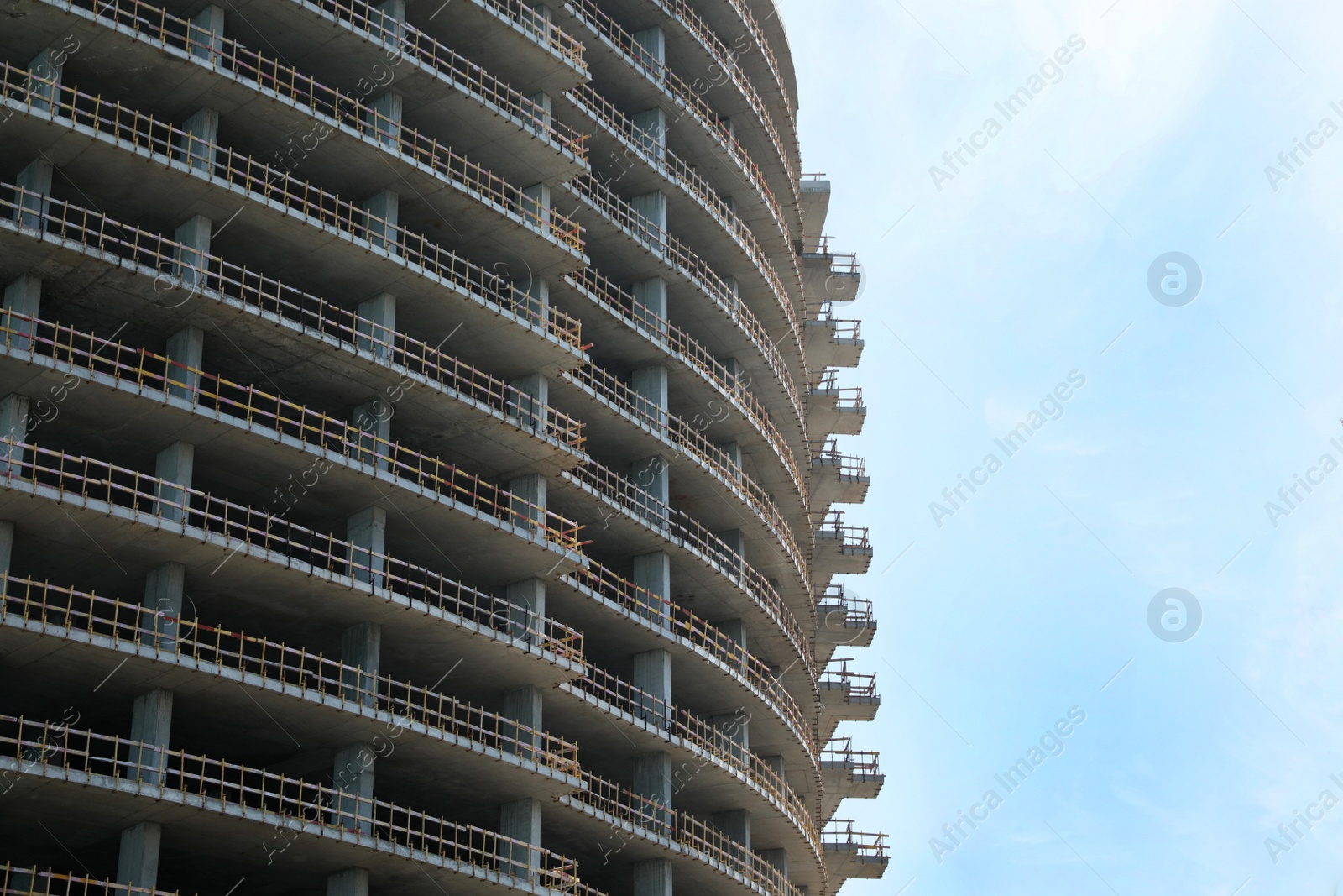 Photo of Construction site with unfinished building on sunny day