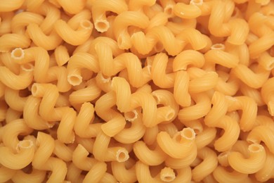 Photo of Raw cavatappi pasta as background, top view