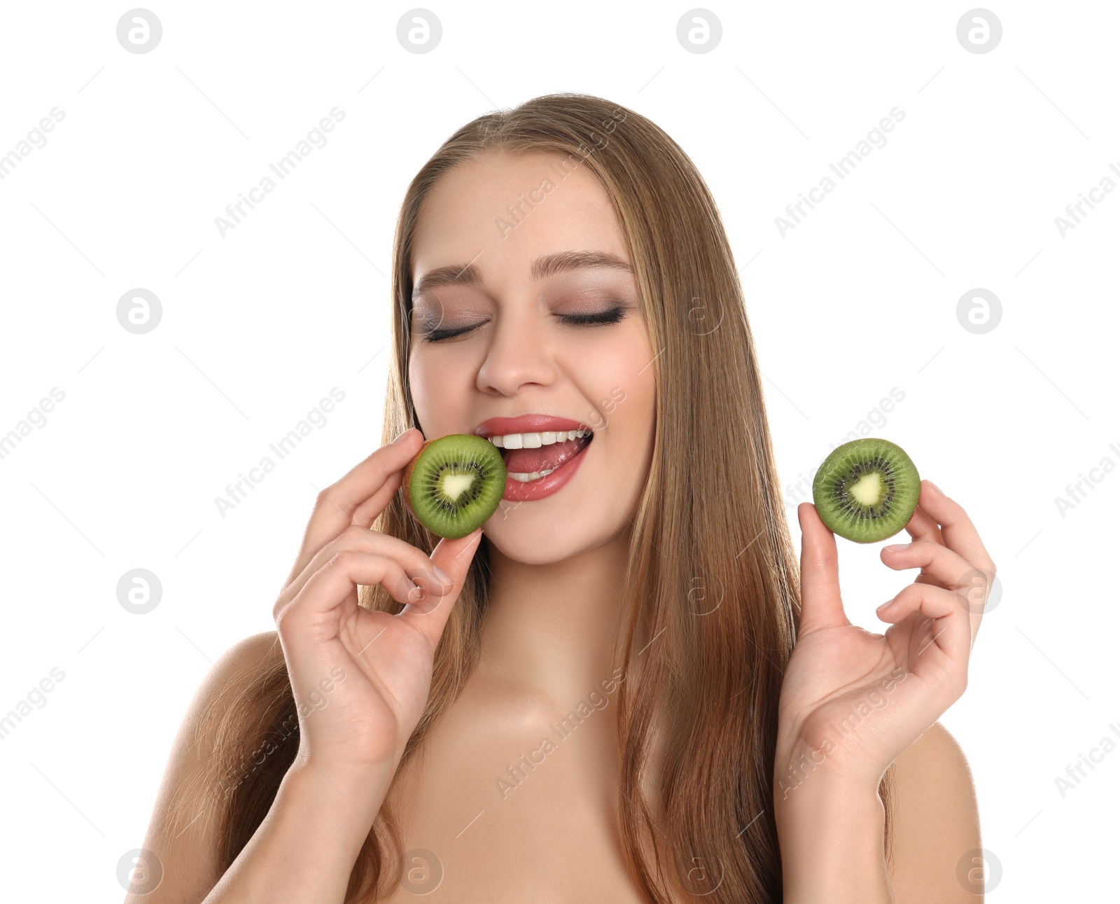 Photo of Young woman with cut kiwi on white background. Vitamin rich food