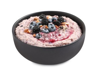 Photo of Tasty oatmeal porridge with different toppings in bowl on white background