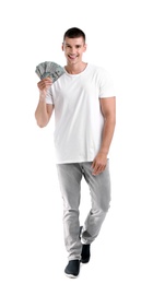 Handsome young man with dollars on white background