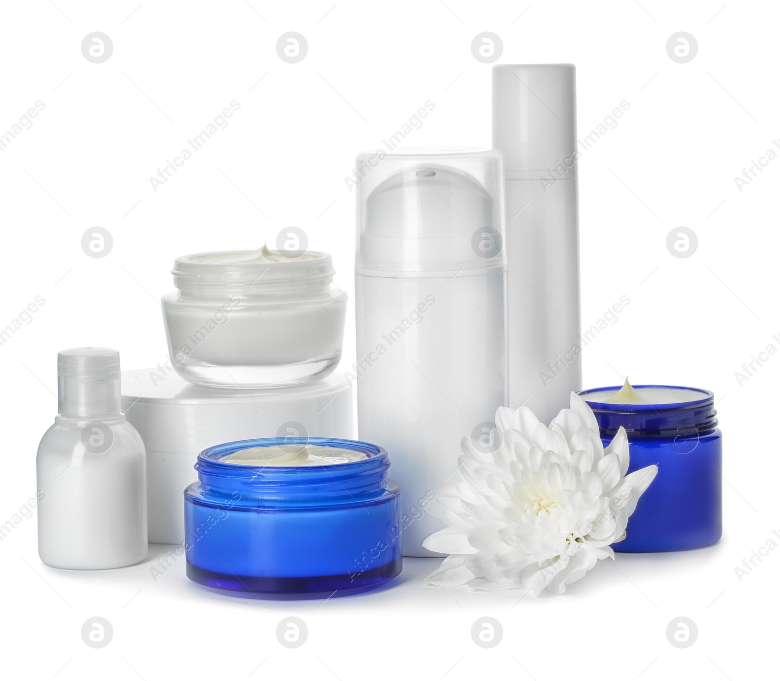 Photo of Jars with cream and bottles on white background. Hand care cosmetics