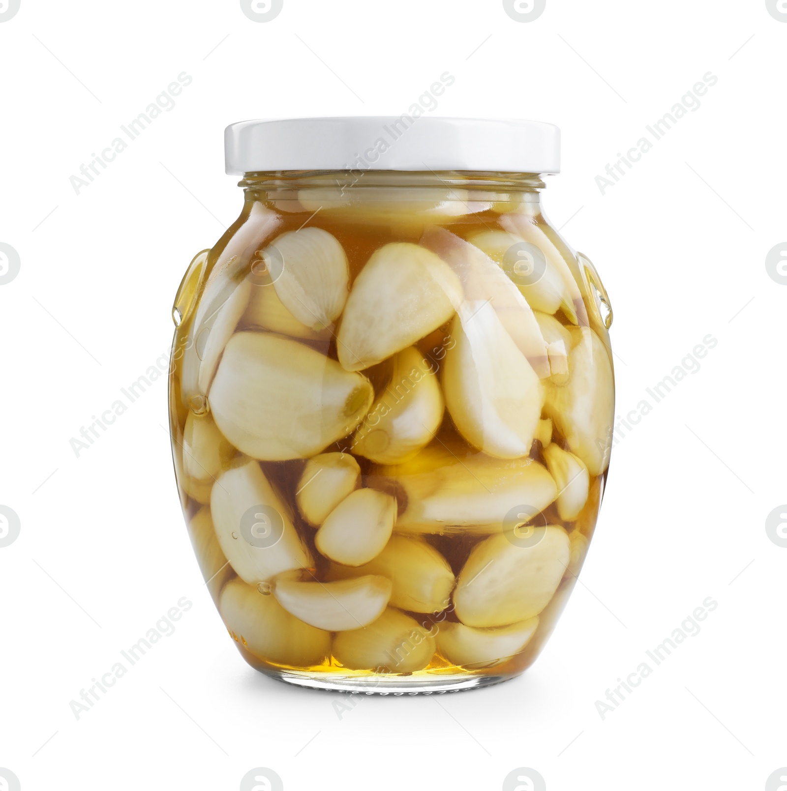 Photo of Garlic with honey in glass jar isolated on white