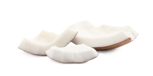 Photo of Pieces of ripe coconut on white background