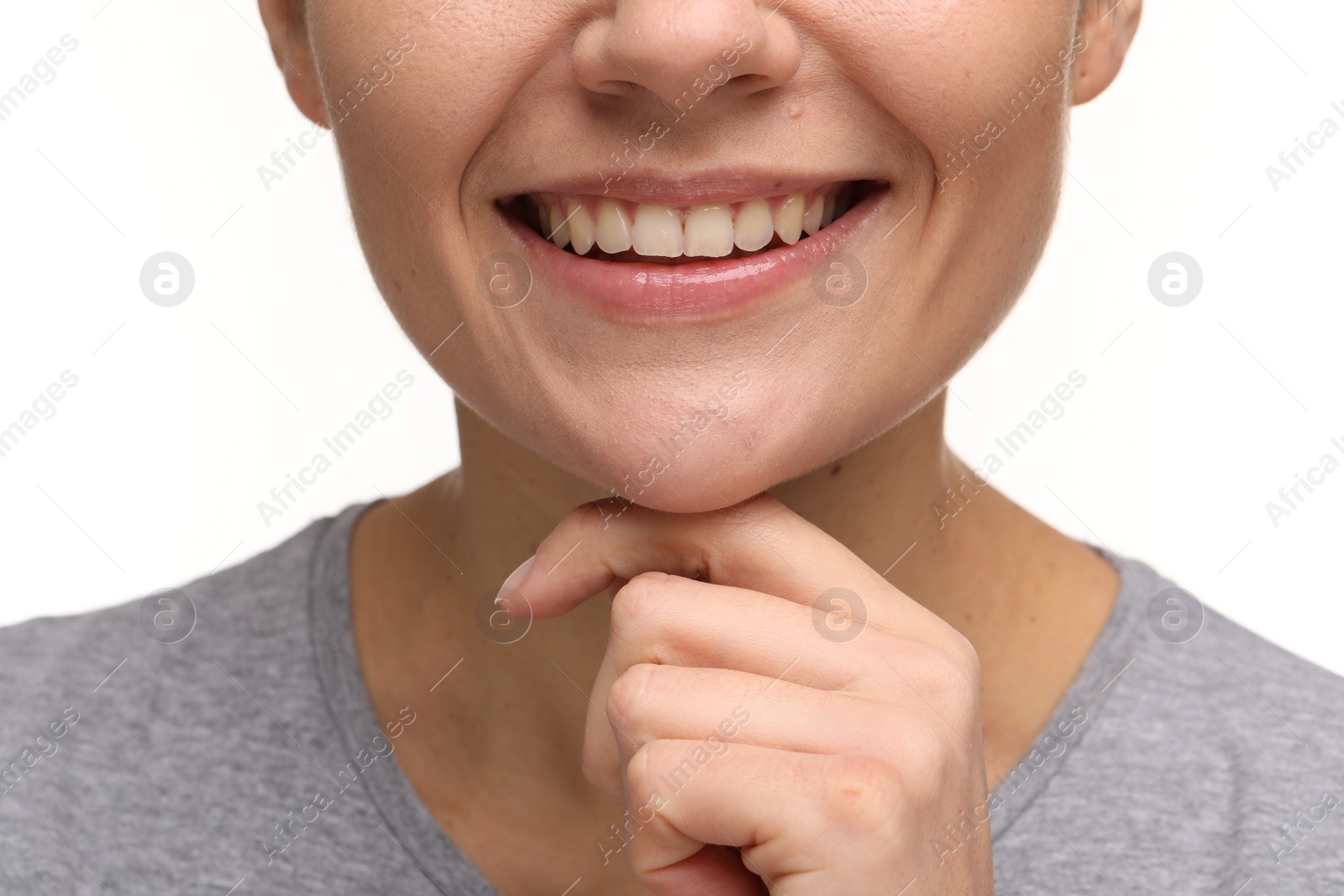 Photo of Woman with clean teeth smiling on white background, closeup