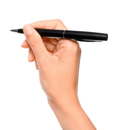 Young woman holding pen on white background, closeup