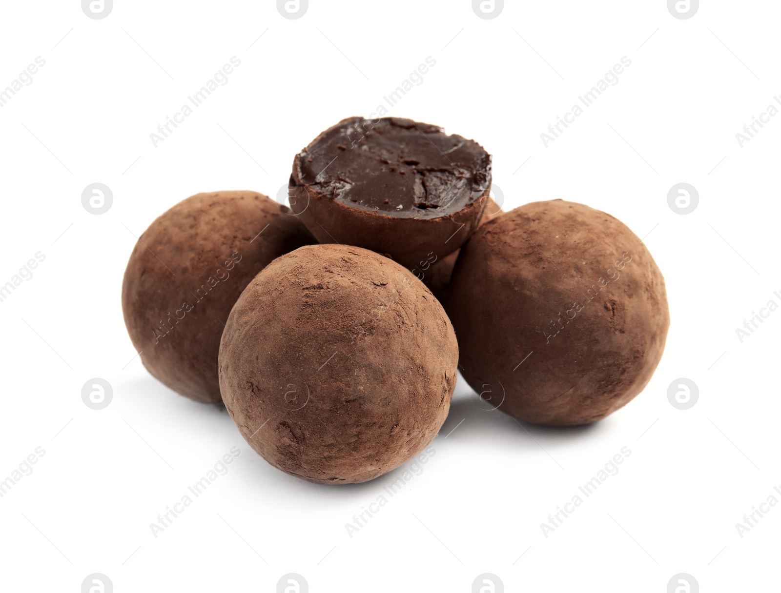 Photo of Delicious raw chocolate truffles on white background
