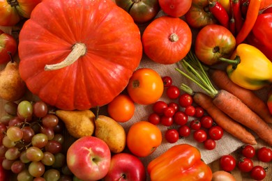 Different fresh ripe vegetables and fruits on wooden table, flat lay