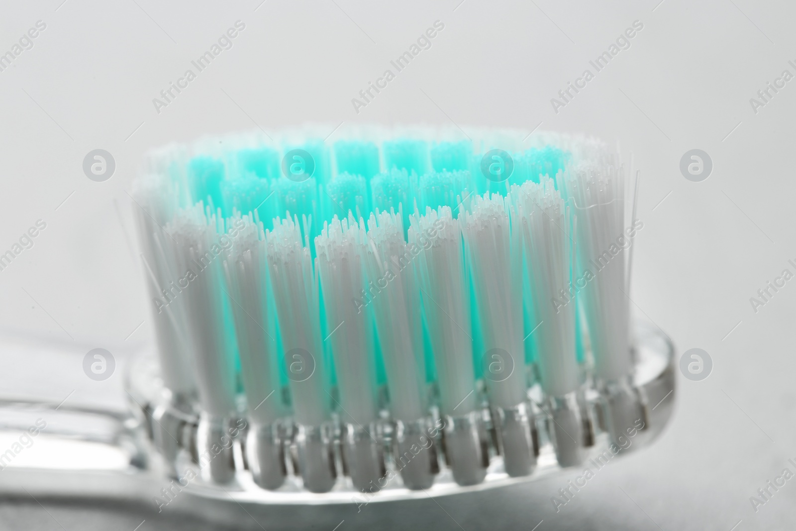 Photo of Manual toothbrush on gray background, close up