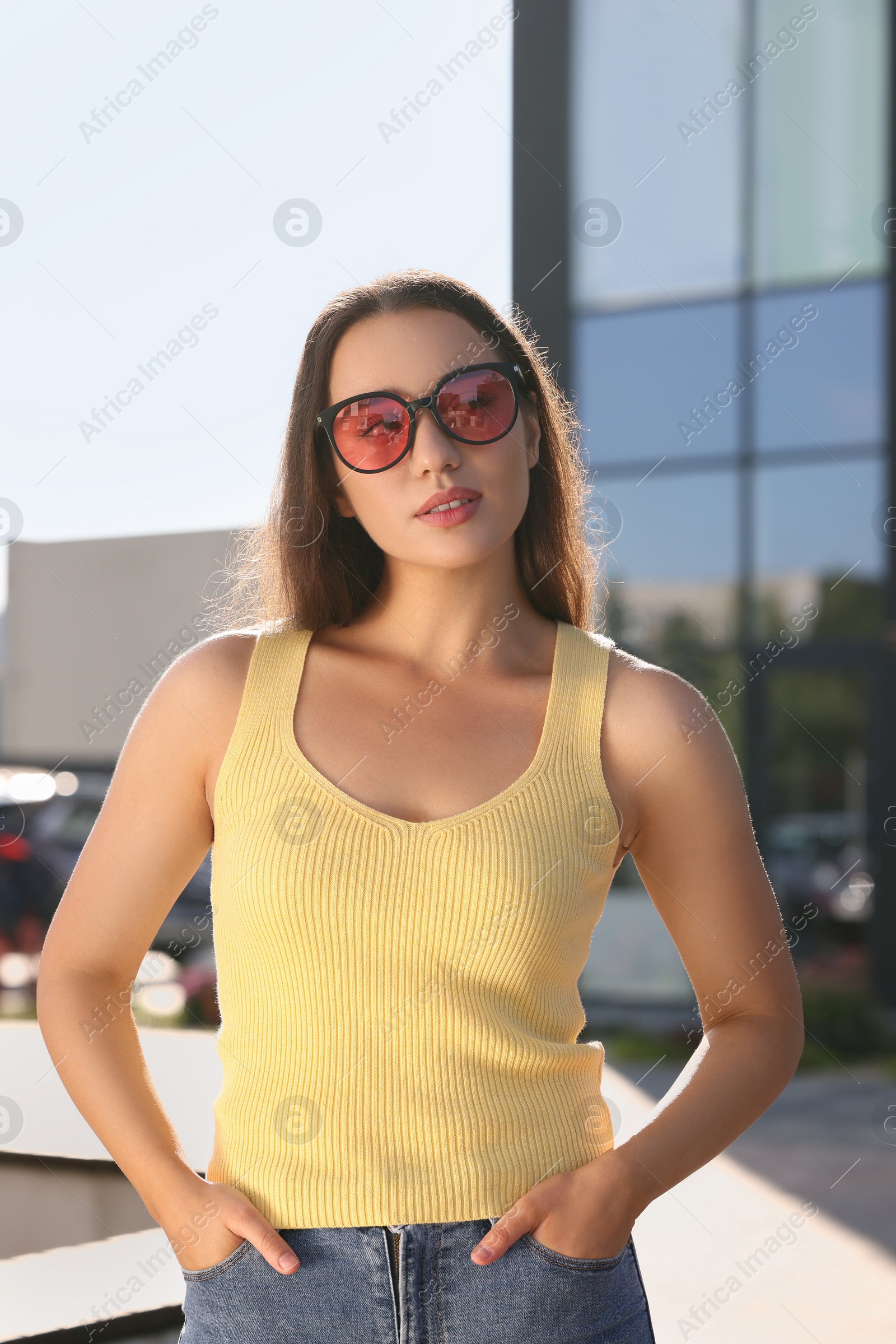 Photo of Beautiful woman in sunglasses on city street