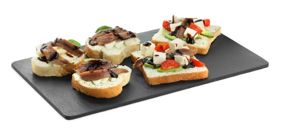 Delicious sandwiches with anchovies, and different ingredients on white background