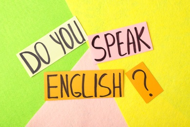 Photo of Question DO YOU SPEAK ENGLISH? on color background, flat lay