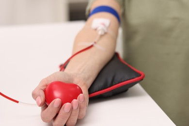 Photo of Patient undergoing blood transfusion in hospital, closeup