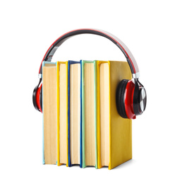 Books with modern headphones isolated on white