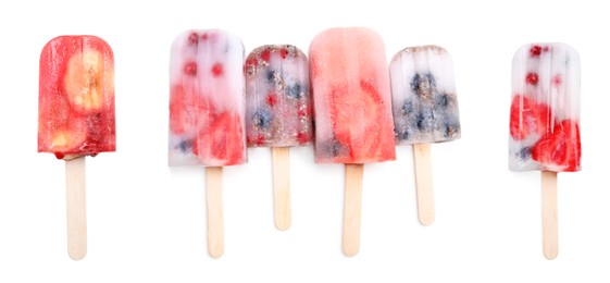 Image of Set with tasty berry ice popsicles on white background. Banner design