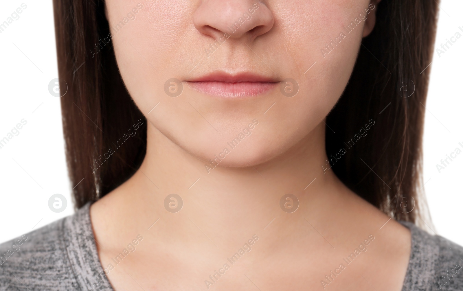 Photo of Young woman on white background, closeup. Focus on lips