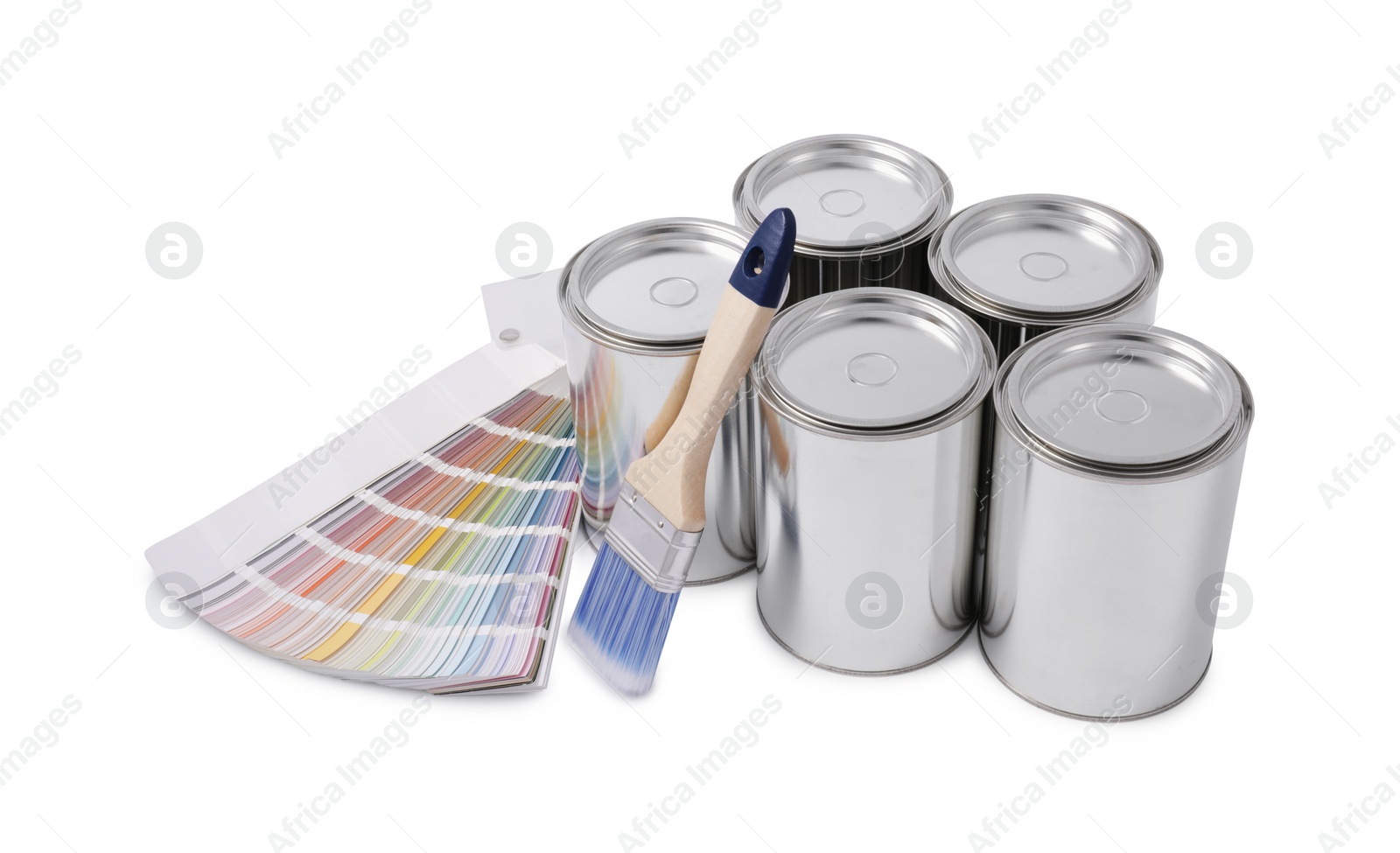 Photo of Cans of paints, brush and color palette on white background