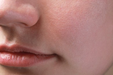 Photo of Closeup view of woman with normal skin and beautiful lips