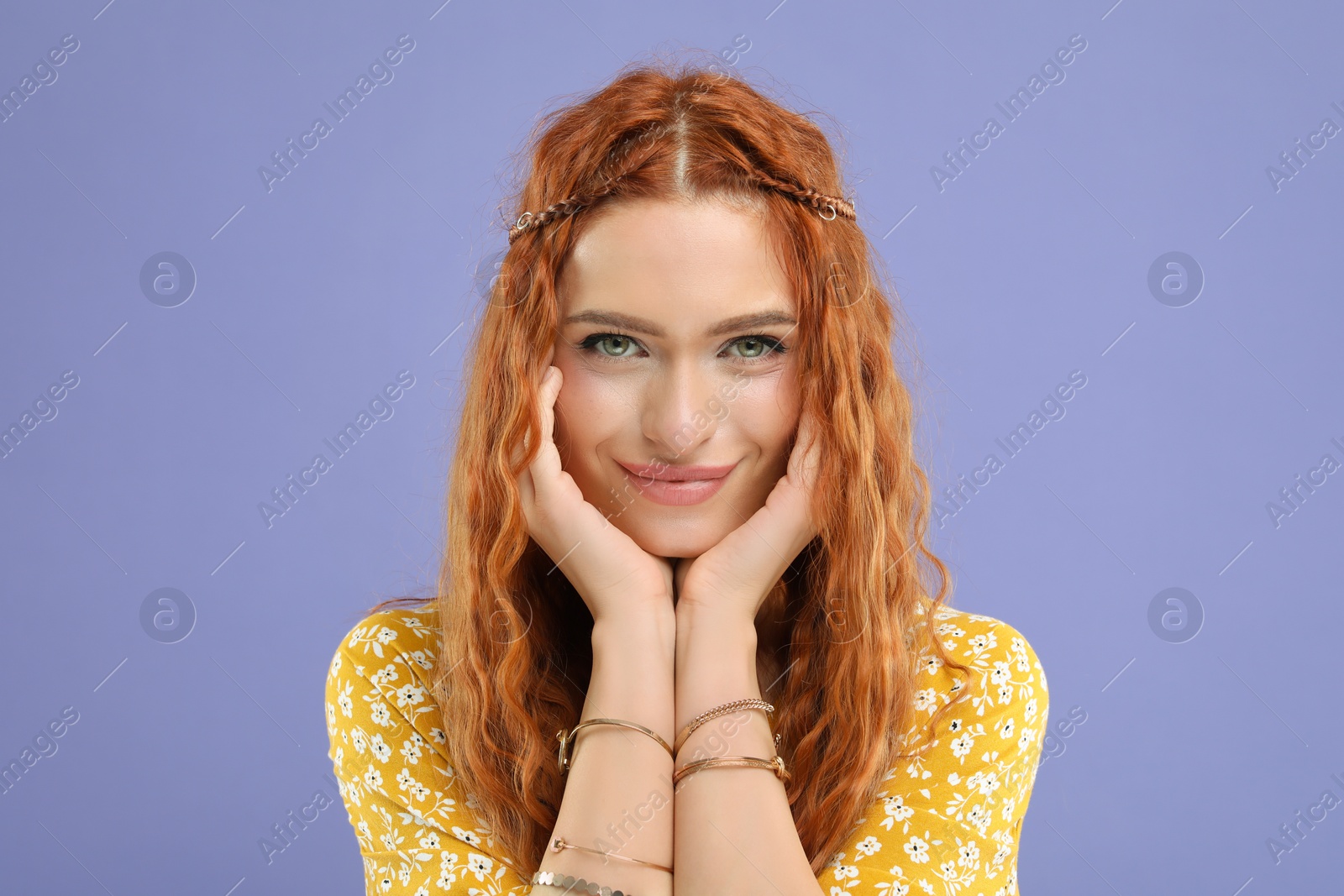 Photo of Beautiful young hippie woman on violet background