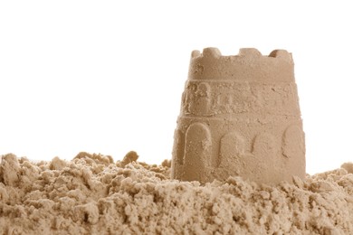 Photo of Pile of sand with castle on white background. Outdoor play