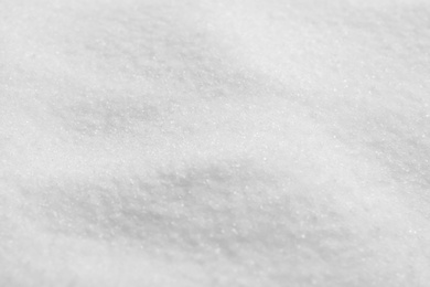 Photo of Natural white salt as background, closeup view